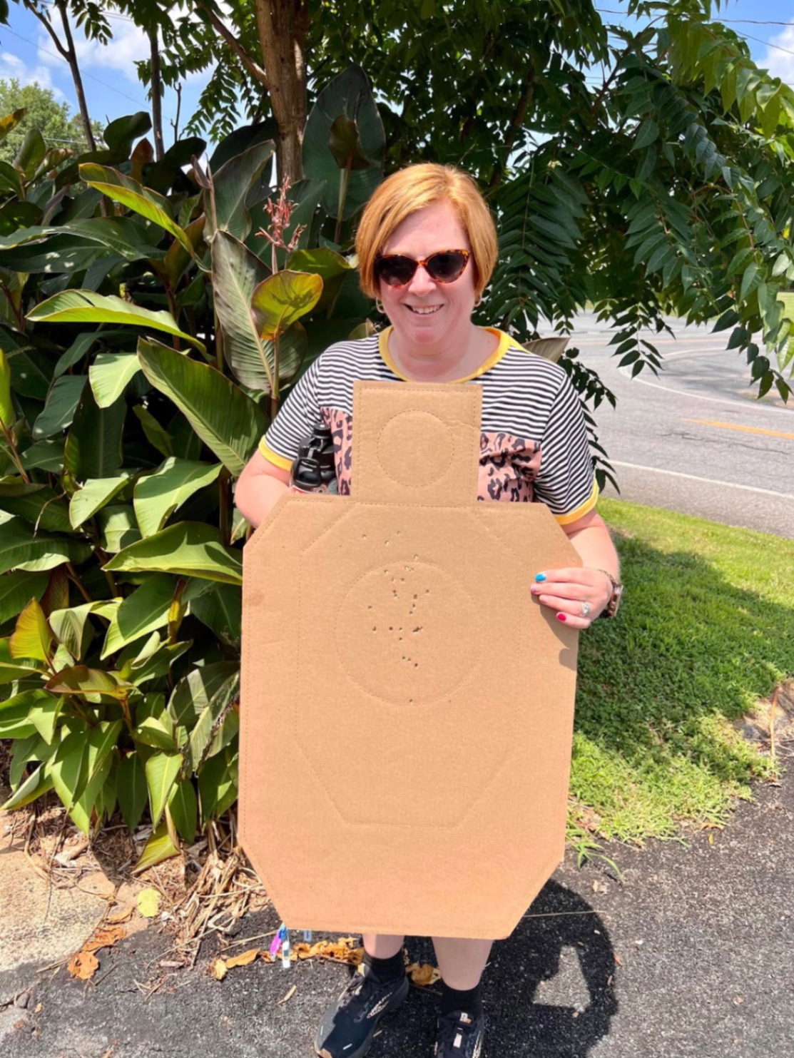 Stephanie Calderon holding her target after concealed carry class